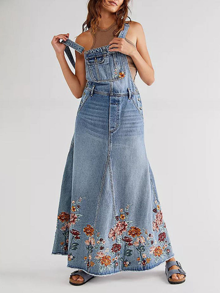 Abito salopette in denim ricamato con motivi floreali