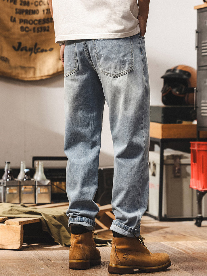 Jean pour homme avec délavage subtil et détails vintage effet usé