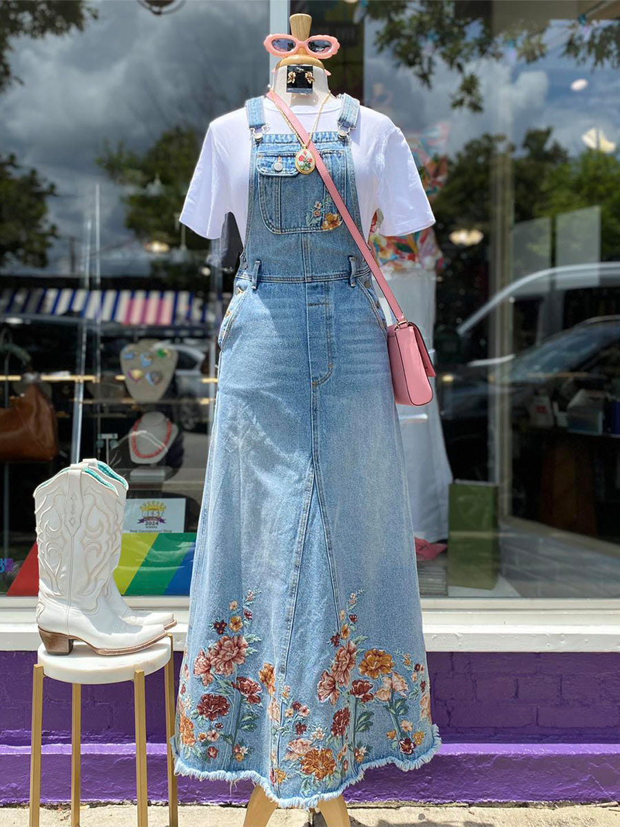 Abito salopette in denim ricamato con motivi floreali