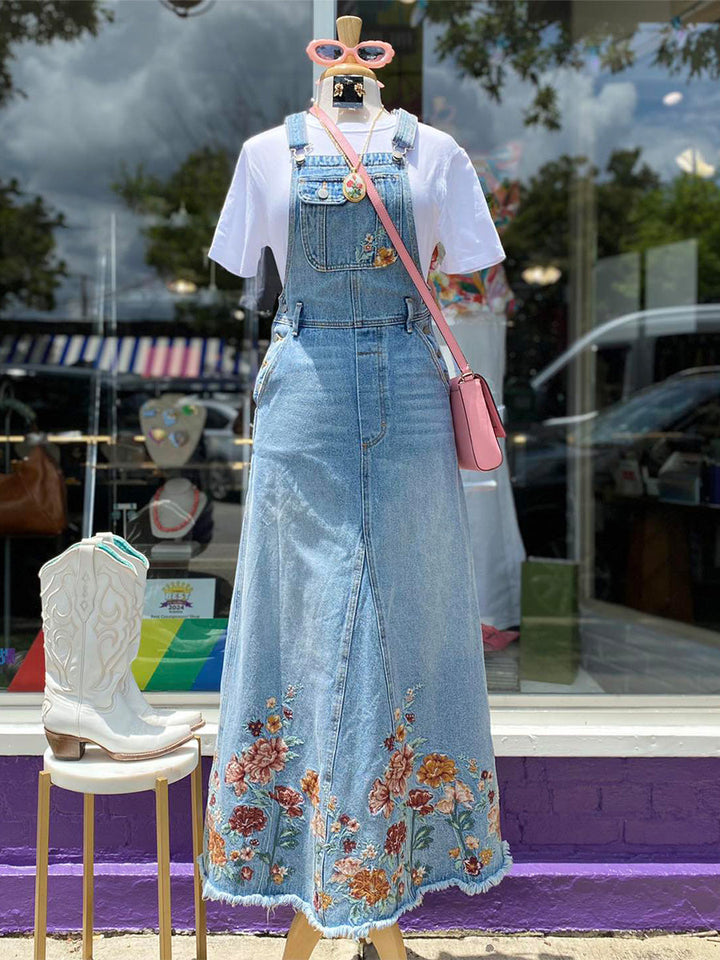 Abito salopette in denim ricamato con motivi floreali