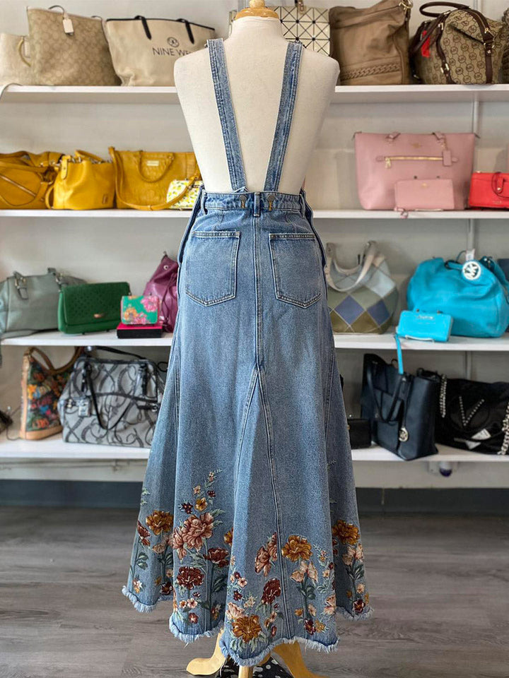 Abito salopette in denim ricamato con motivi floreali