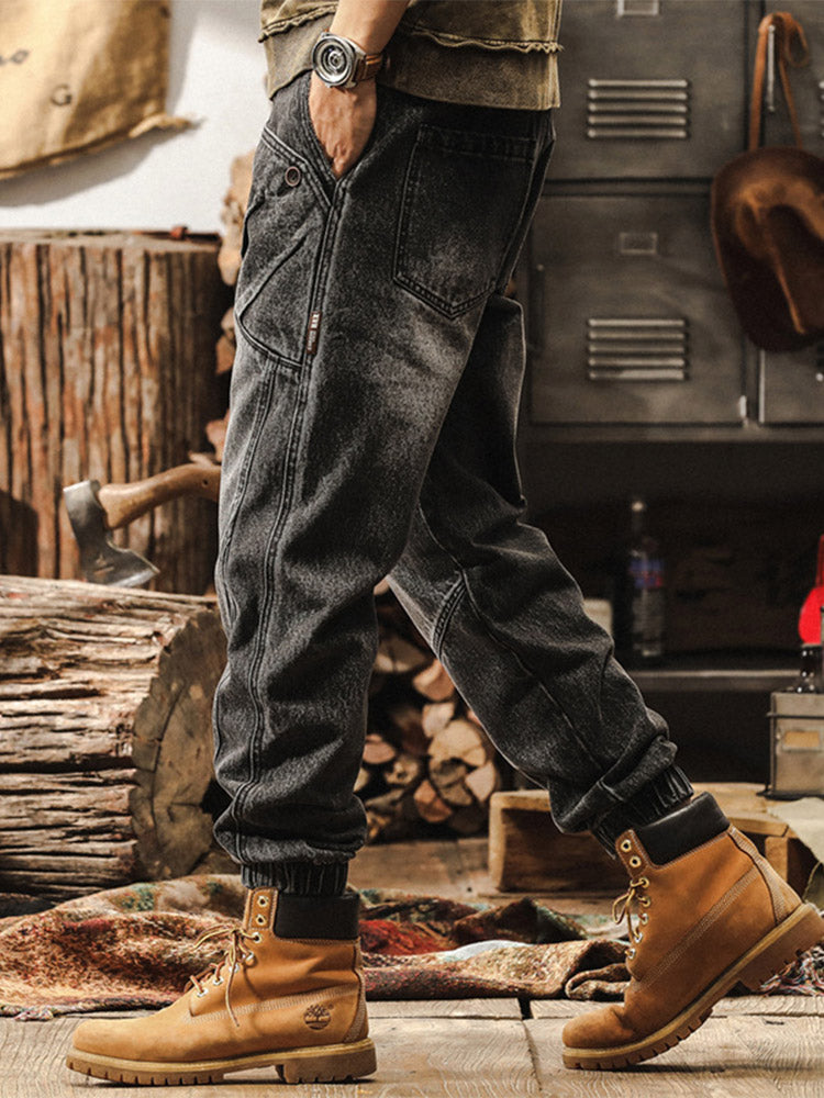 Herrenjeans mit weitem Bein, Vintage-Waschung und elastischen Beinabschlüssen