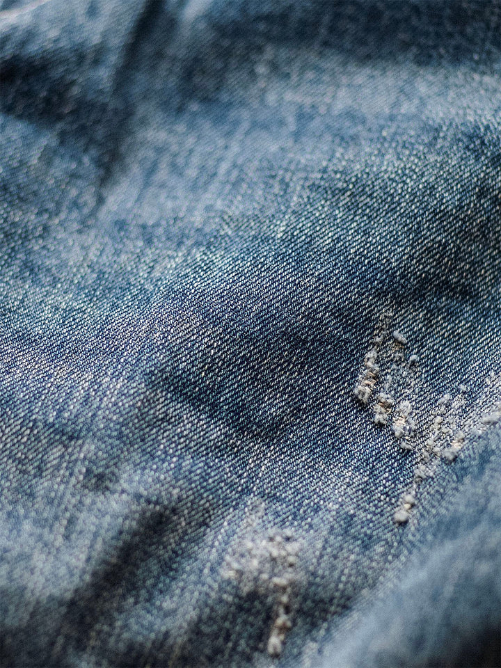Salopette in denim usurato da uomo